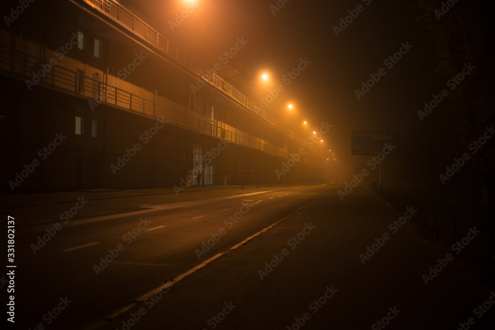 Highway at night in the fog in the city