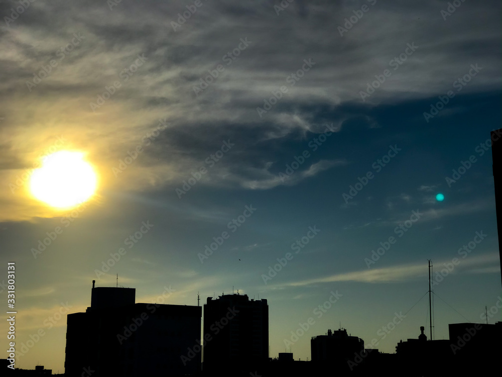 silhouette of city at sunset