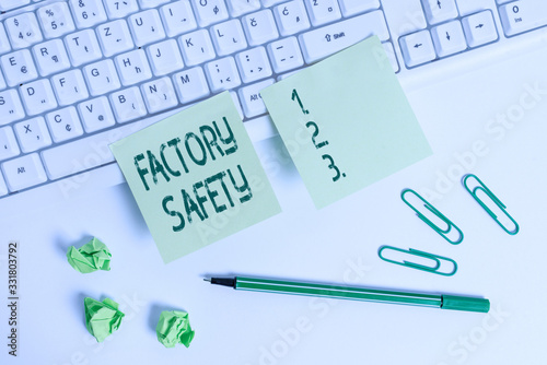 Handwriting text writing Factory Safety. Conceptual photo minimize risk of worker injury while doing production tasks Square green note paper with pencil on the white background photo