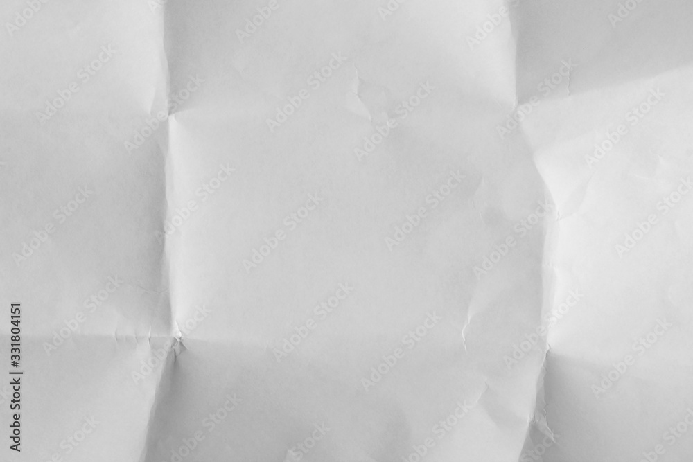 Obraz premium Лист белой бумаги смятый а потом расправленный Выборочный фокус.