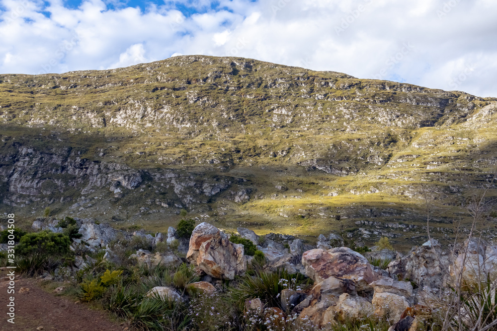 Roadside, with rocks and mountains in the background, Lapinha da Serra, Santana do Riacho, Minas Gerais, Brazil Roadside, with rocks and mountains in the background, Lapinha da Serra, Santana do Riacho, Minas Gerais, Brazil