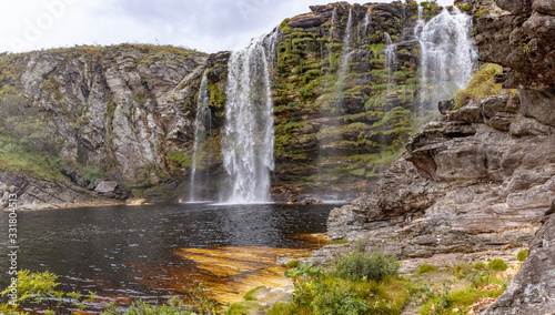 Bicame waterfall and lake with rust-colored waters  Lapinha da Serra  Santana do Riacho  Minas Gerais  Brazil