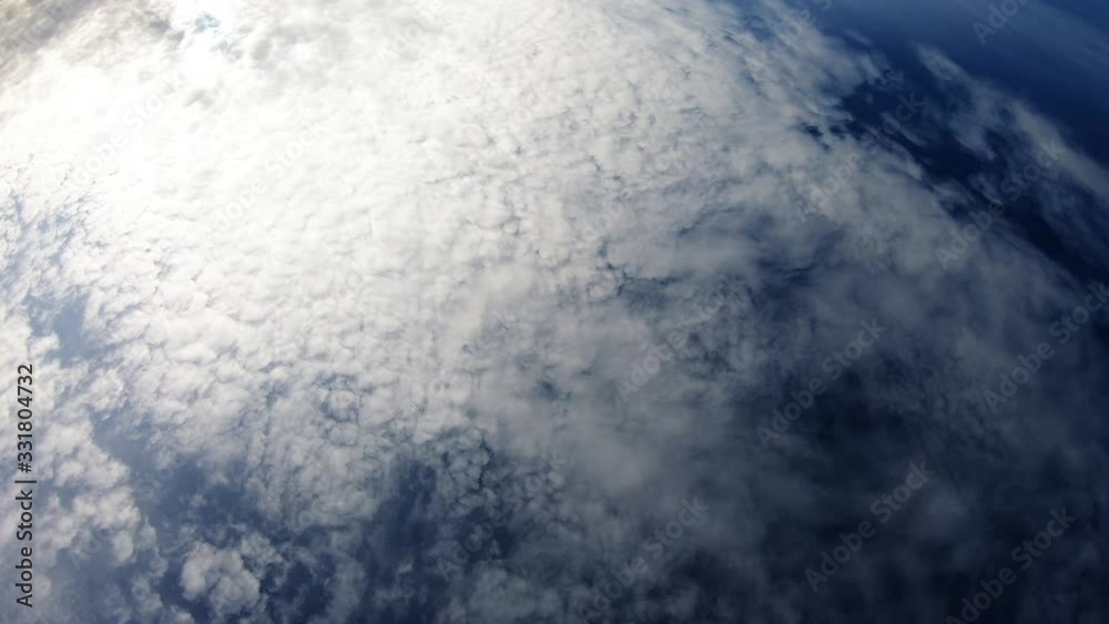 Cloudy Day With Blue Sky And Sun Showing Trough Clouds Cloudy Day With Blue Sky And Sun Showing Trough Clouds