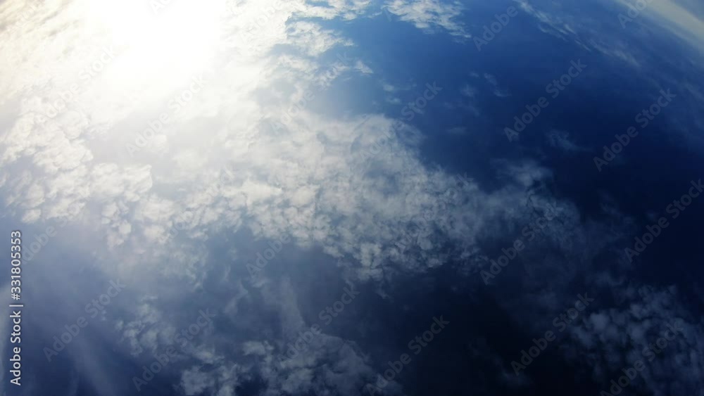 Cloudy Day With Blue Sky And Sun Showing Trough Clouds Cloudy Day With Blue Sky And Sun Showing Trough Clouds