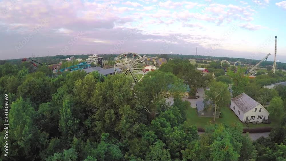 Theme park drone shot with farris wheel and other amusement park rides. Theme park drone shot with farris wheel and other amusement park rides.