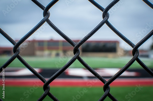 Behind the fence view of football field