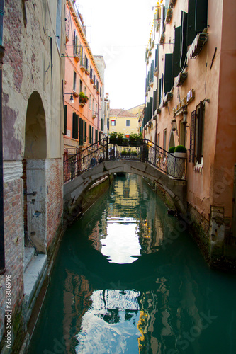 Traditional Venice Cityscape with narrow canal, gondola