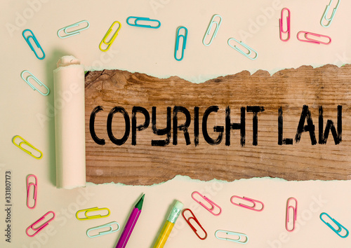 Conceptual hand writing showing Copyright Law. Concept meaning body of law that governs the original works of authorship