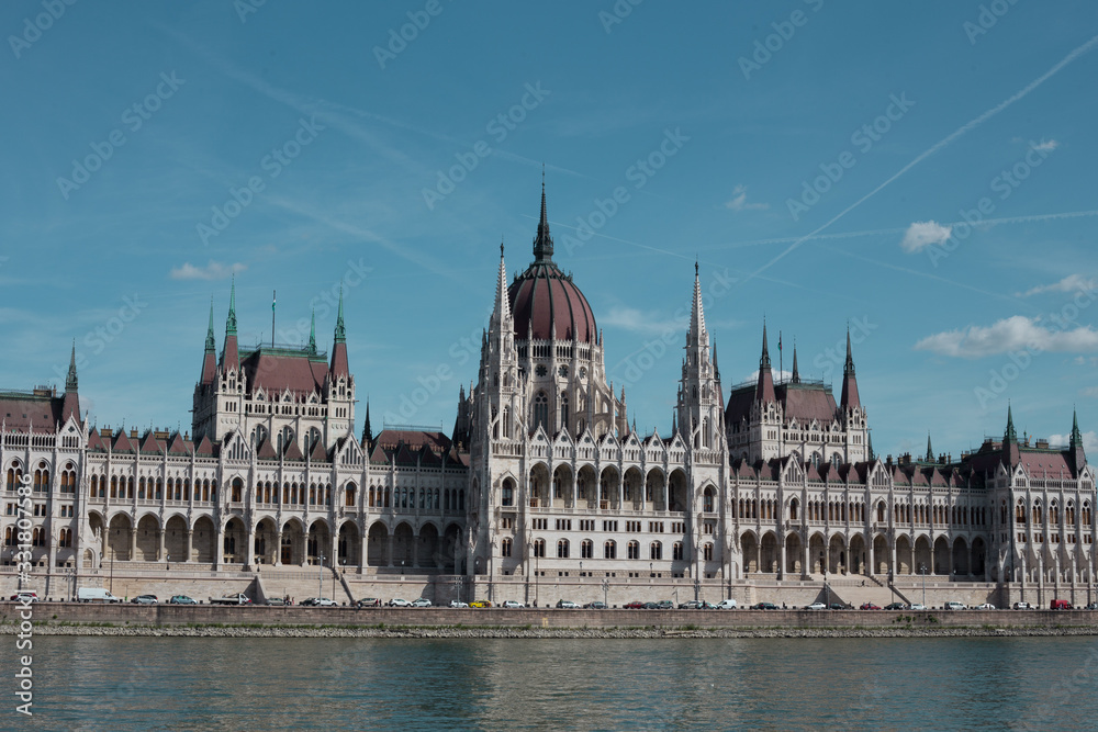 Fototapeta premium Budapest Parliament Building in the afternoon against a clear blue sky