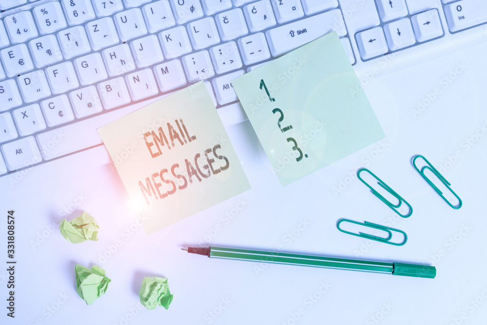 Handwriting text writing Email Messages. Conceptual photo a messages that has been sent using electronic mail Square green note paper with pencil on the white background