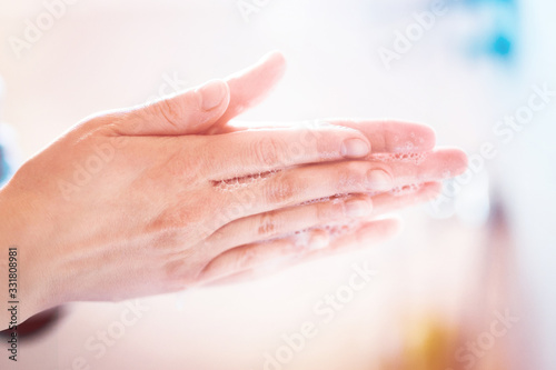 Washing hands under running water using soap, important step for a good hygiene