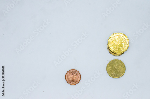 Different Euro cent coins in a pail.