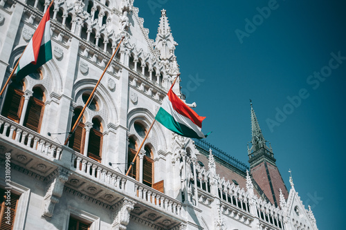 Hungary flag on the facade of the Budapest Parliament Building