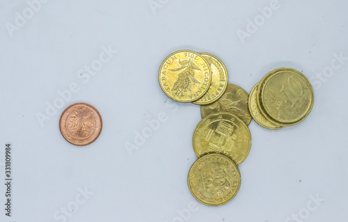 Different Euro cent coins in a pail