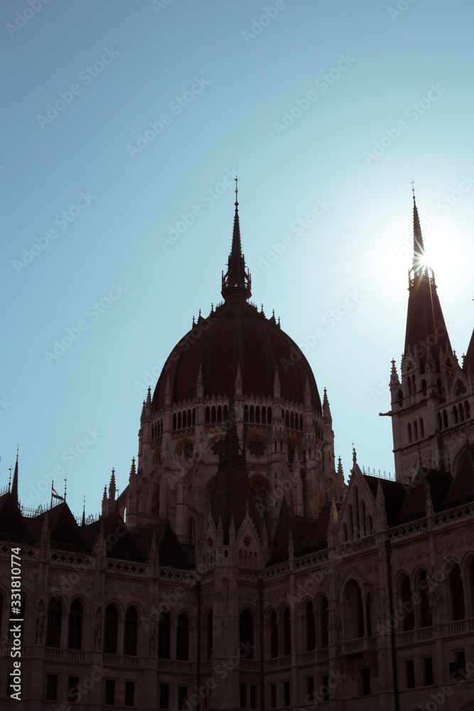 Budapest Parliament Building in the afternoon against a clear blue sky