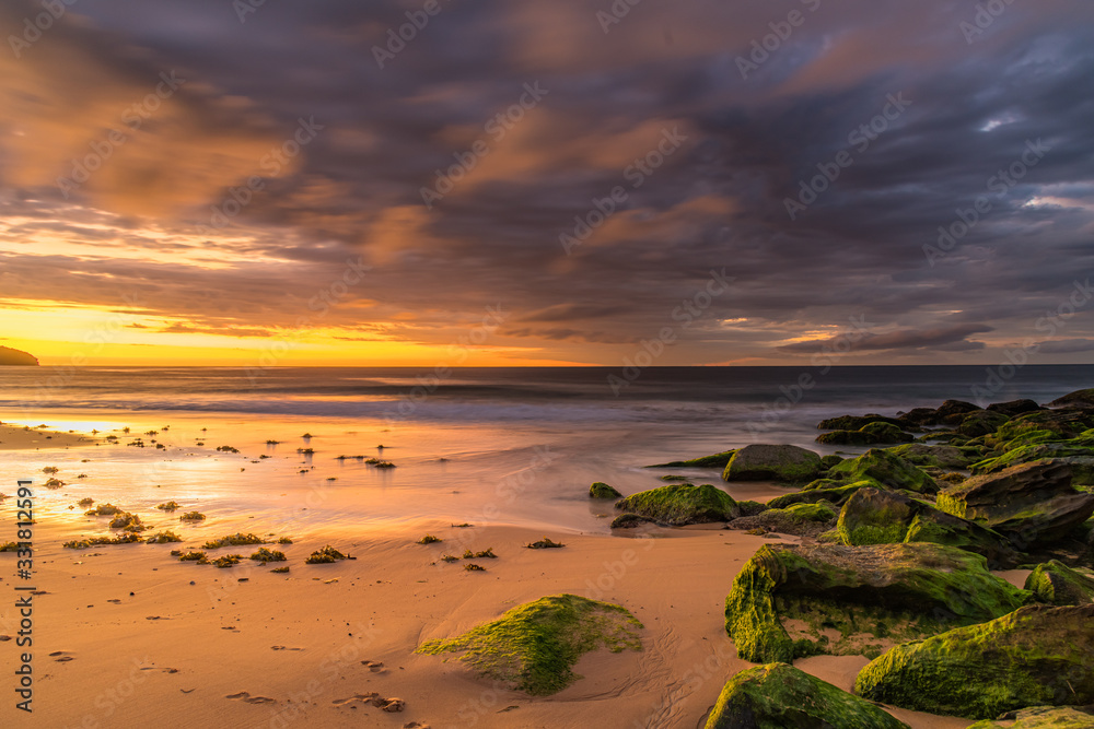 Clouds and Green Mossy Rocks Sunrise Seascape