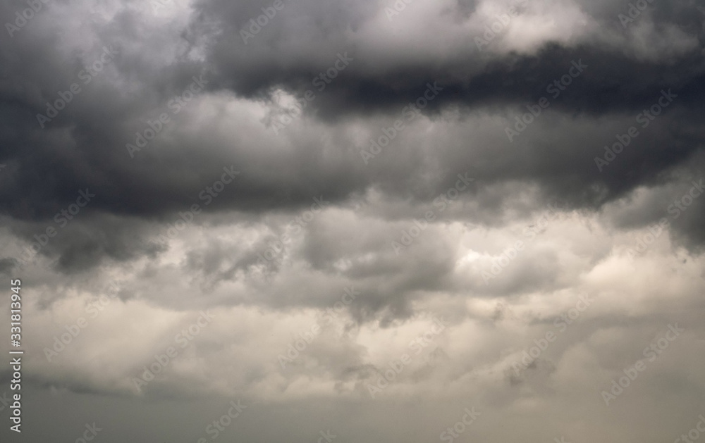 Clouds gather and turn dark, indicating stormy weather is on the way