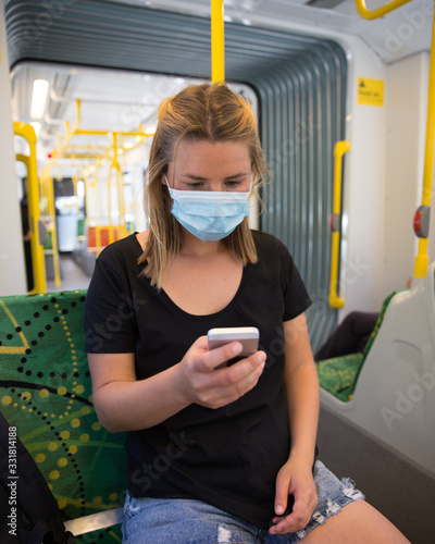 Young Woman Wearing Mask Travelling on Public Transport