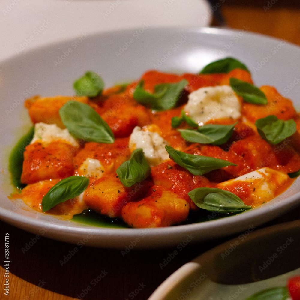 Tomato gnocchi with cheese and basil Tomato gnocchi with cheese and basil
