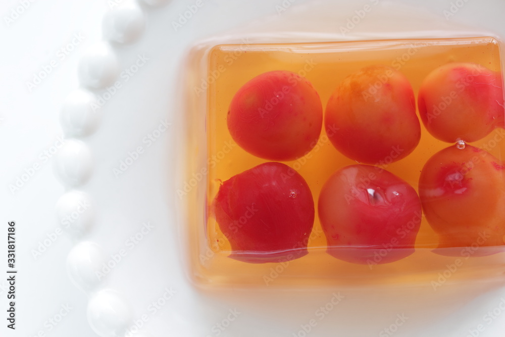 Cherry jelly on plate with tea for dessert Cherry jelly on plate with tea for dessert