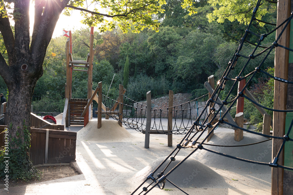 Modern outdoor playground with slides and climbing frames