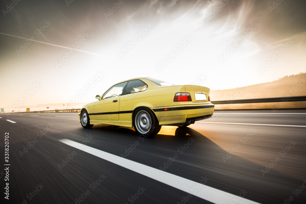 Yellow taxi car on the highway