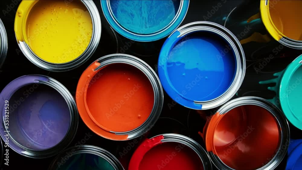 Aluminium cans with vivid, colorful paint inside stacked on the floor of a warehouse. top view slider wiring