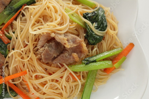 Chinese food  Pork and green leaf vegetable fried noodles