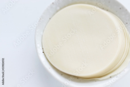 Chinese food ingredient, gyoza dough skin on white background