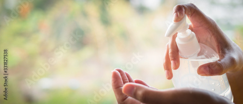 Konstfotografi The hand of a woman who is using an alcohol gel to clean, prevent the virus, Covid 19
