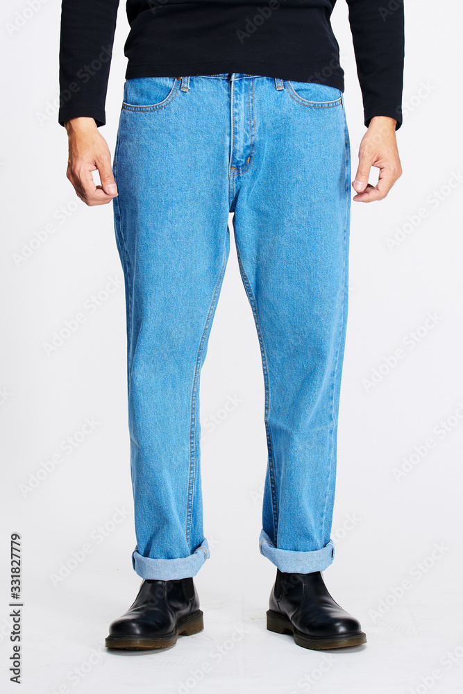 Male model in blue jeans bottom on white background. Male model in blue jeans bottom on white background.