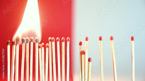 Social Distancing concept clip using matches igniting to depict how social distancing can help to flatten the curve / spread of the corona virus - Social healthcare and medical issues. photo