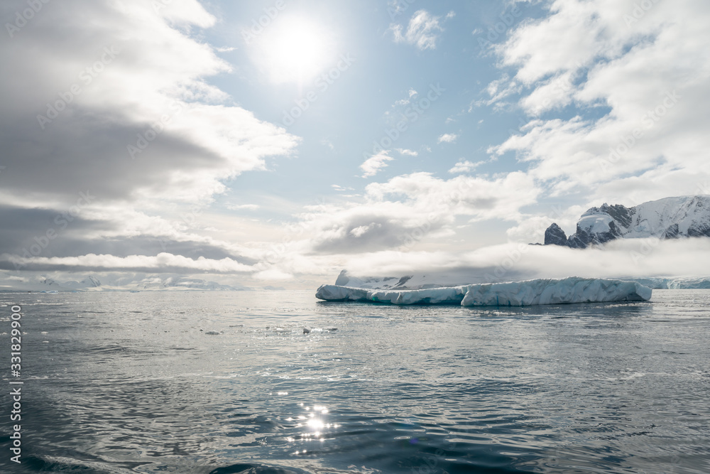 Water level landscape with ice bergs in Antarctica