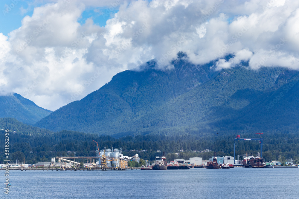 Fototapeta premium Thick clouds over the coastal mountains, Vancouver, BC, Canada