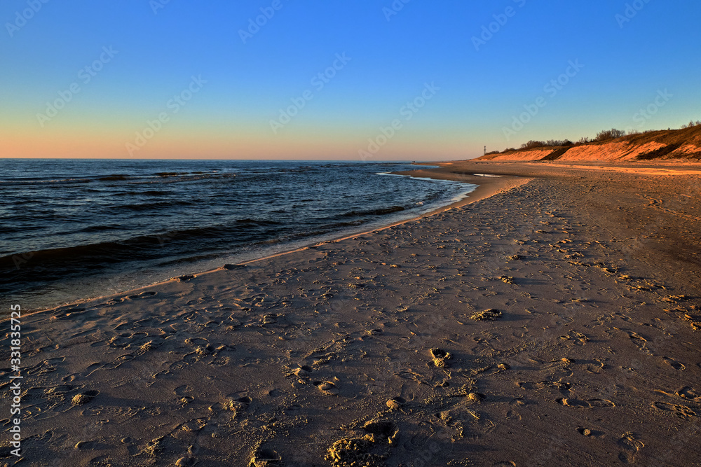 Sunset at Baltic sea and nordic dunes of Curonian spit, Nida, Lithuania