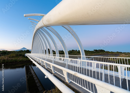 Te Rewa Rewa Bridge is a pedestrian and cycleway bridge across the Waiwhakaiho River at New Plymouth in New Zealand. Its spectacular shape and setting make it a popular landmark. photo