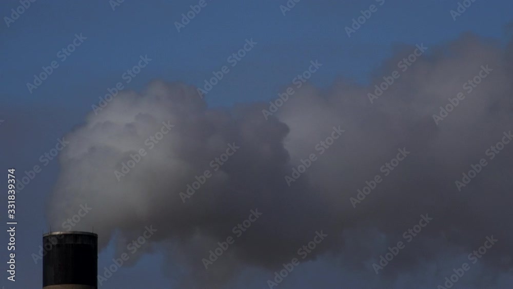 Chimney pumping out smoke into atmosphere UK 4K Chimney pumping out smoke into atmosphere UK 4K