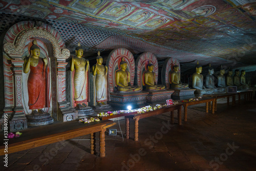 Ancient sculptures of Buddha in the cave temple of Rangiri Dambulu Vihara. Dambulla, Sri Lanka photo