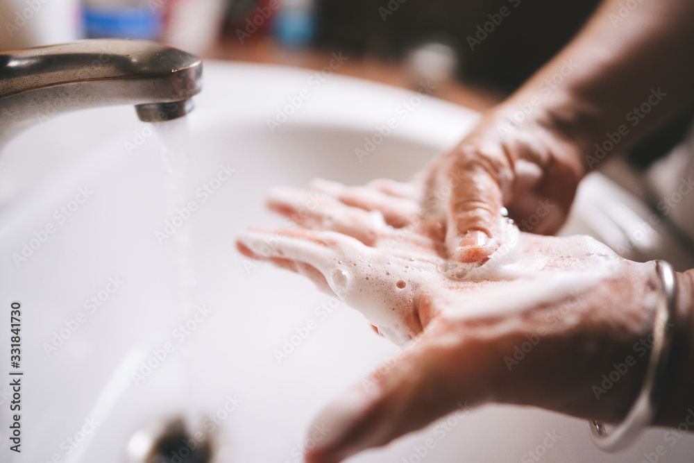 Asian elderly woman washing hand with foam soap. Asian elderly woman washing hand with foam soap.