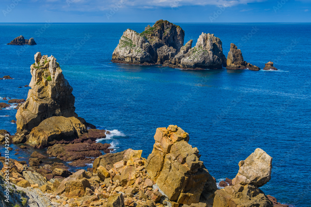 Incredible cliffs on the coast near the village of Liencres. Cantabria. Northern coast of Spain