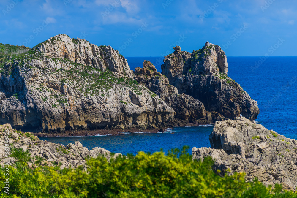 Incredible cliffs on the coast near the village of Liencres. Cantabria. Northern coast of Spain