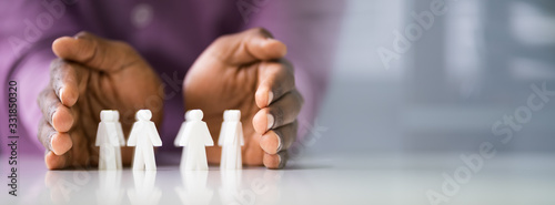 Person Protecting Multicolored Pawns