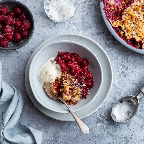 delicious cherry crumble pie served with vanilla ice cream photo