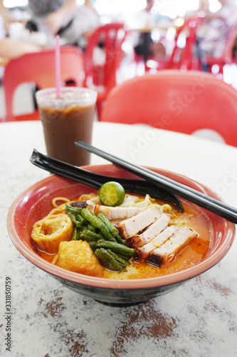 Laksa consists of thick wheat noodles or rice vermicelli with chicken, prawn or fish, served in spicy soup based on either rich and spicy curry coconut milk