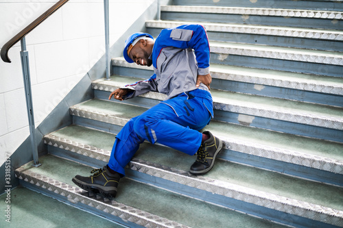 Worker Man Lying On Staircase photo