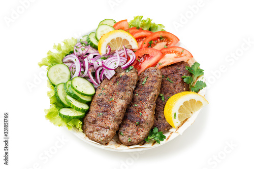 Grilled meat kebabs (cutlets) served with vegetables and tortilla, flatbread. isolated on white background