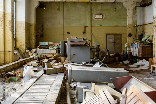 Photo of a room with the garbage of an abandoned destroyed plant. Slums, waste. © Вячеслав Чичаев