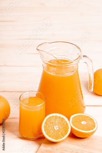 glass and jar of fresh orange juice
