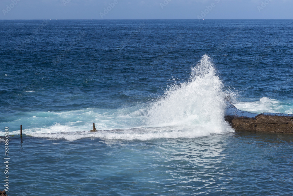 wave splashes on stones at Tenerife island, Spain, Canary islands wave splashes on stones at Tenerife island, Spain, Canary islands