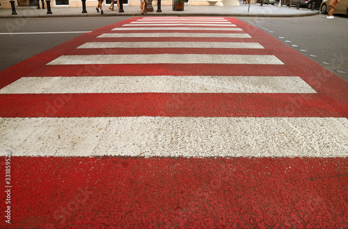 Diminishing Perspective of Red and White Urban Pedestrian Crosswalk